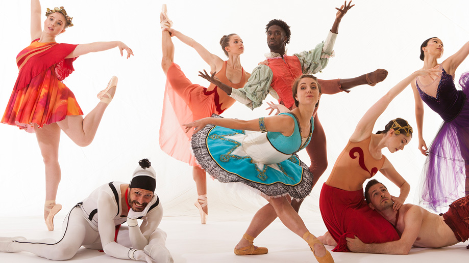 A diverse group of ballet dancers in colorful costumes perform various dynamic poses against a white background. some are leaping, while others crouch or recline gracefully.