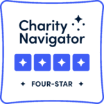 Logo of charity navigator with the text “charity navigator” at the top, followed by four blue stars, an indicator of a four-star rating, and the text “four-star” at the bottom, all framed by a light border.